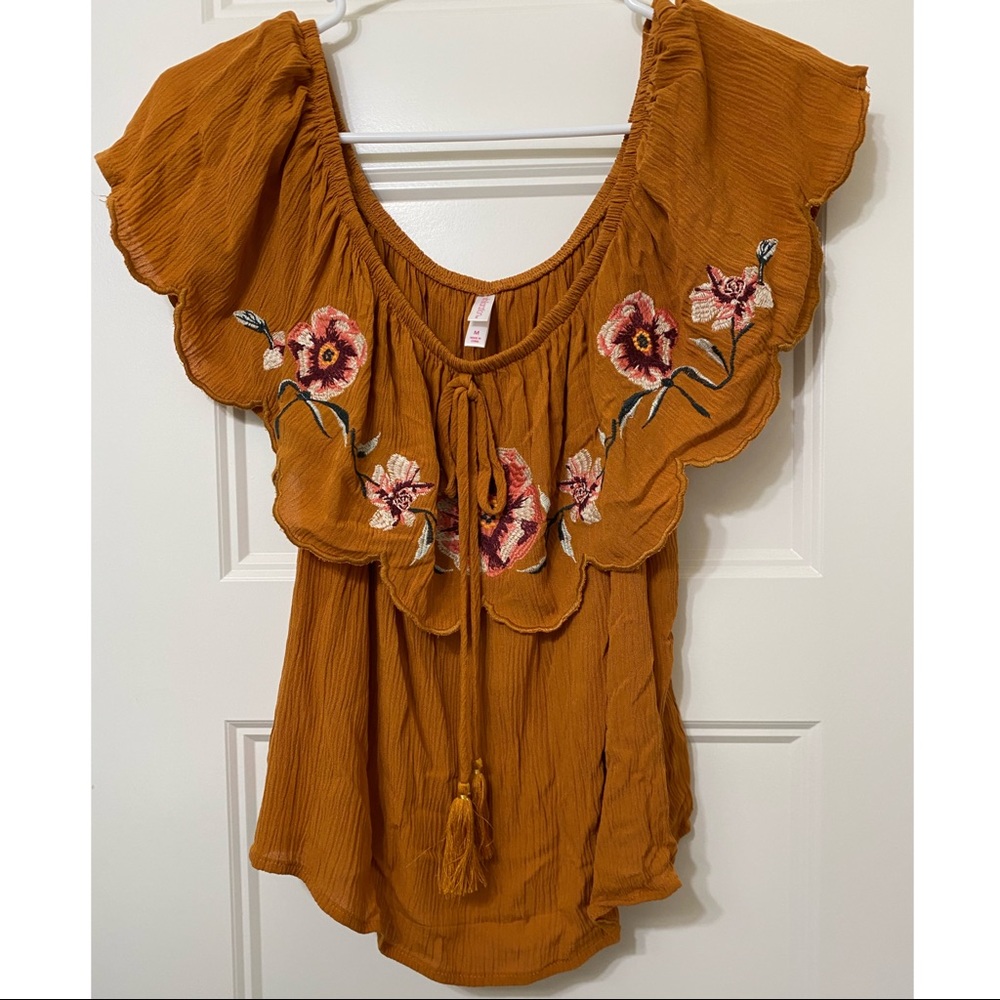Orangey brown off the shoulder blouse